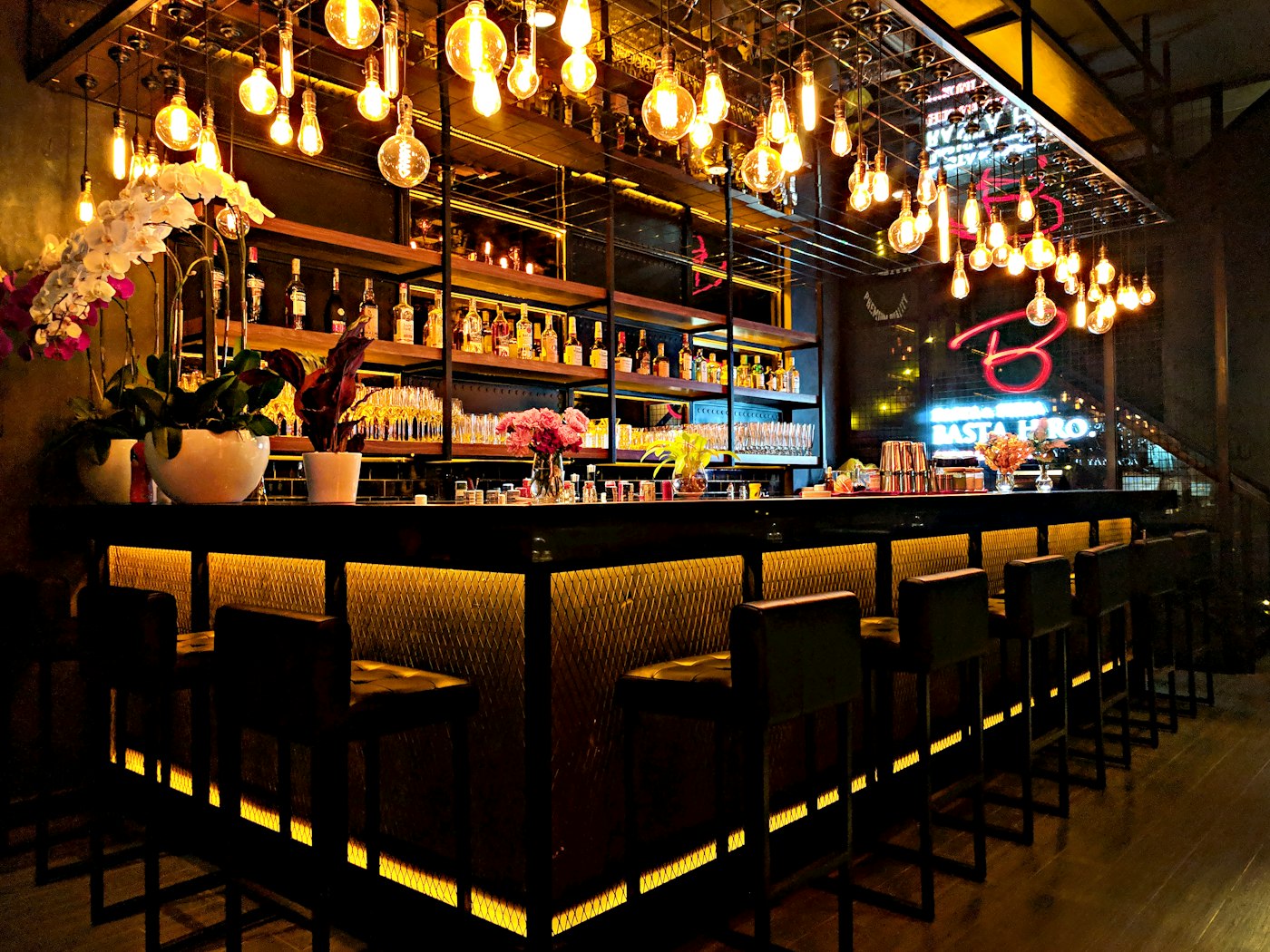 Cocktail bar glowing with edison bulbs